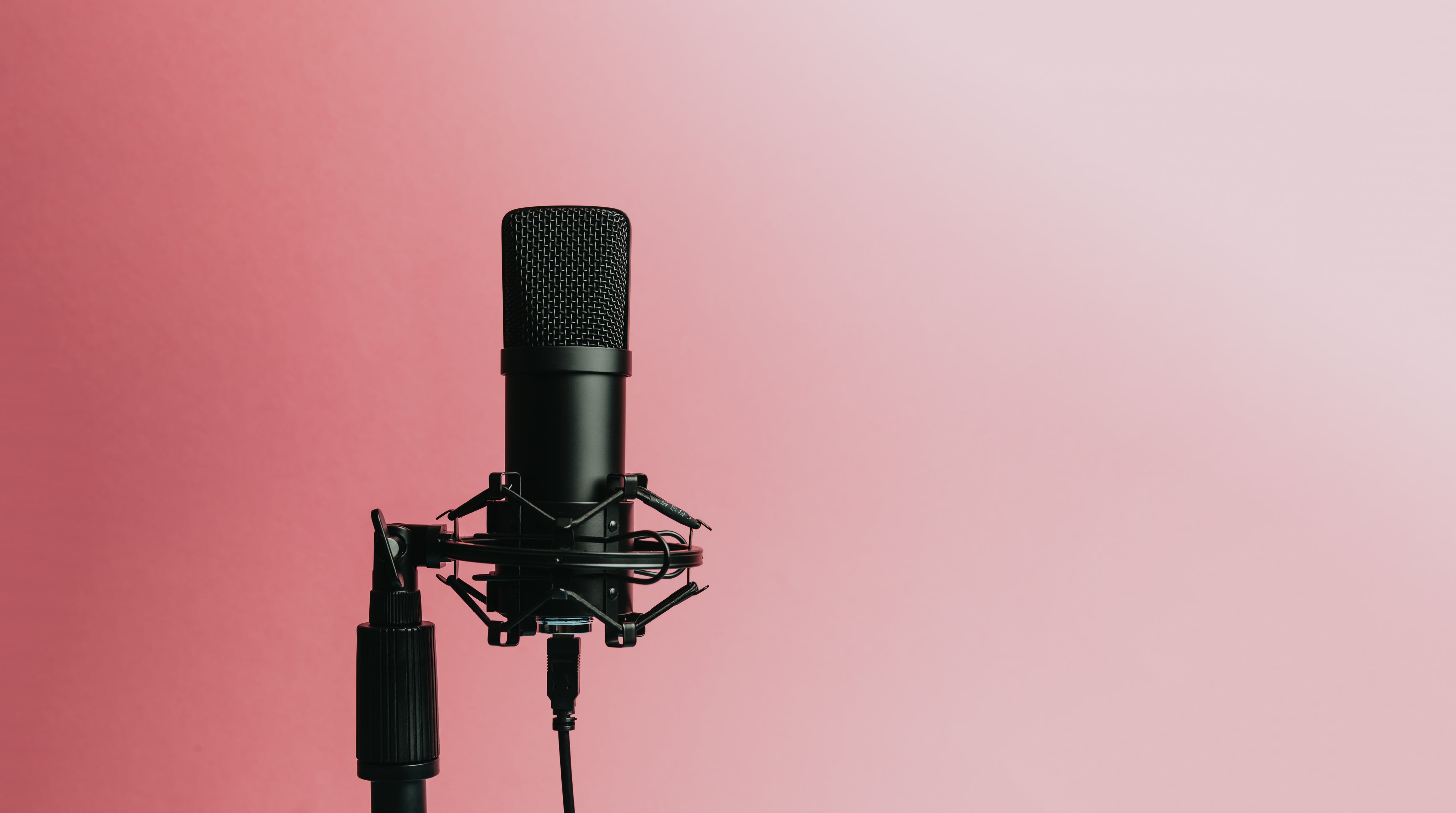 black-microphone-set-against-a-pink-background.jpg