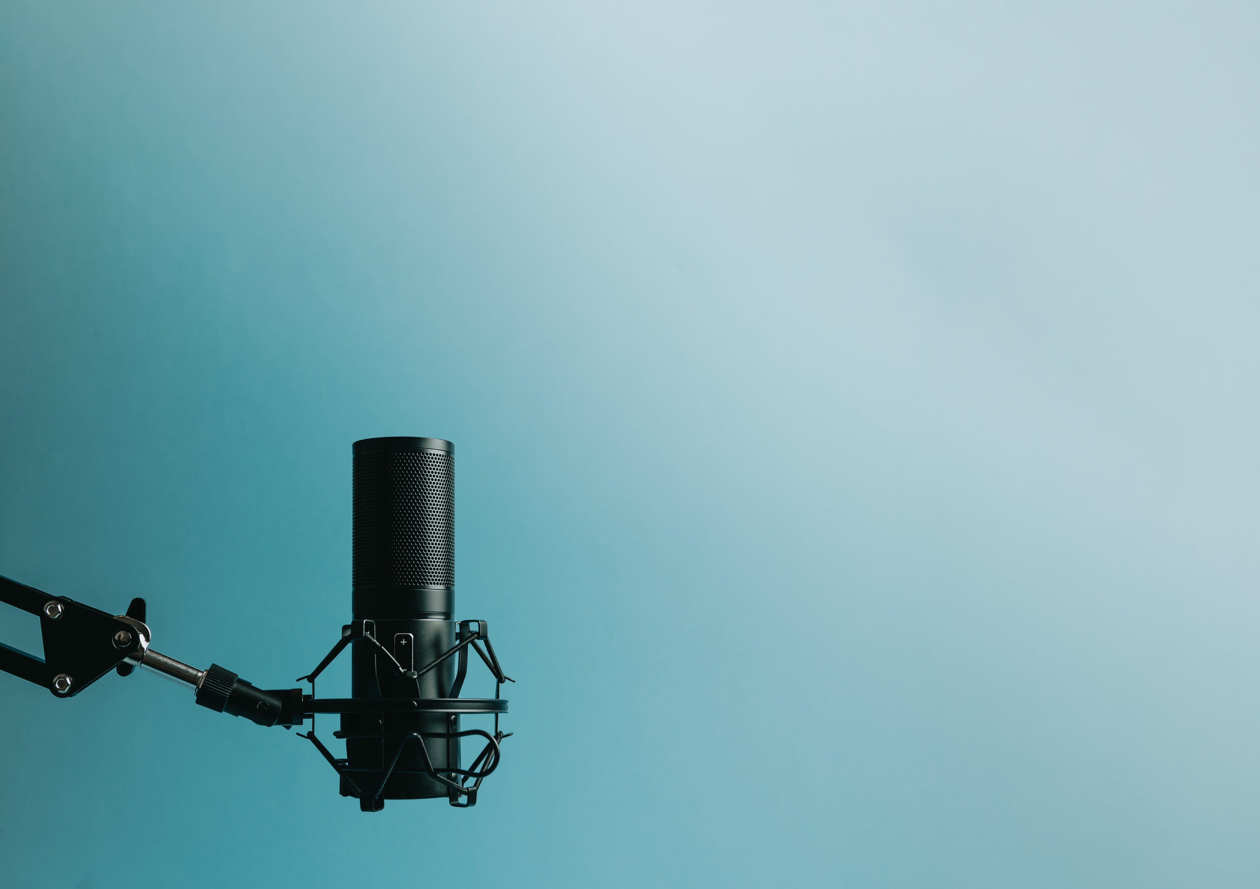 microphone-on-stand-left-of-frame-against-blue.jpg